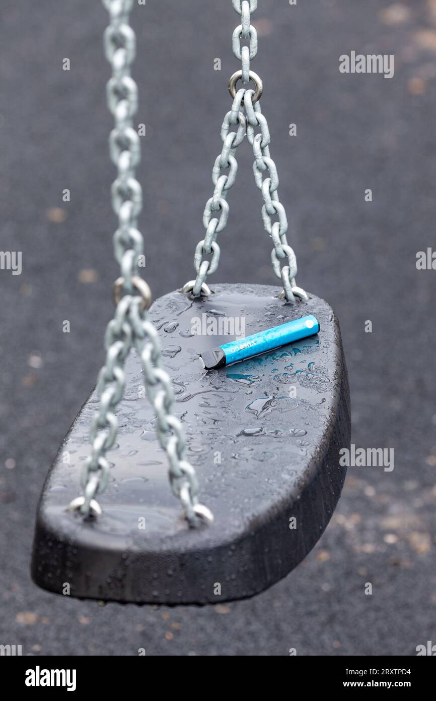 Used Disposable vape discarded in a play park in Scotland Stock Photo
