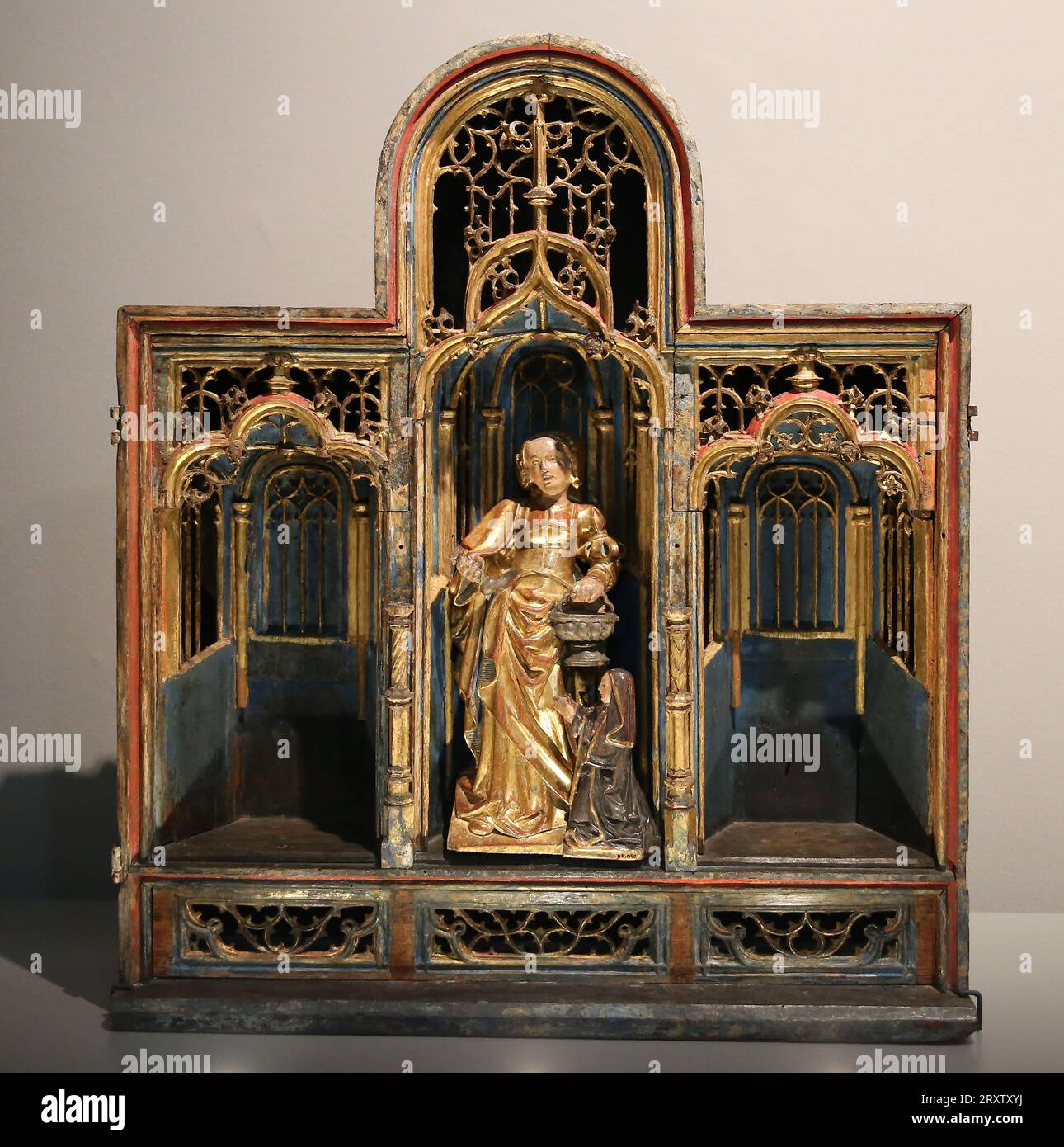 Small altarpiece of Saint Martha. Workshop of the Southern Netherlands. Carved, gilded and polychromed wood. Pedralbes Monastery Museum. Barcelona. Sp Stock Photo