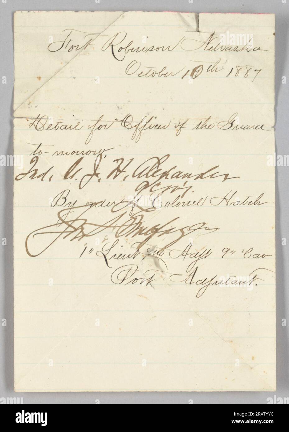 Hand-written order issued to second lieutenant John Hanks Alexander to report for Officers of the Guard duty at Fort Robinson, Nebraska on October 10, 1887. The document was written by an unidentified first lieutenant by order of Colonel Edward Hatch. The document was written in black ink on white paper and has several creases. Both sides of the document have writing. Stock Photo