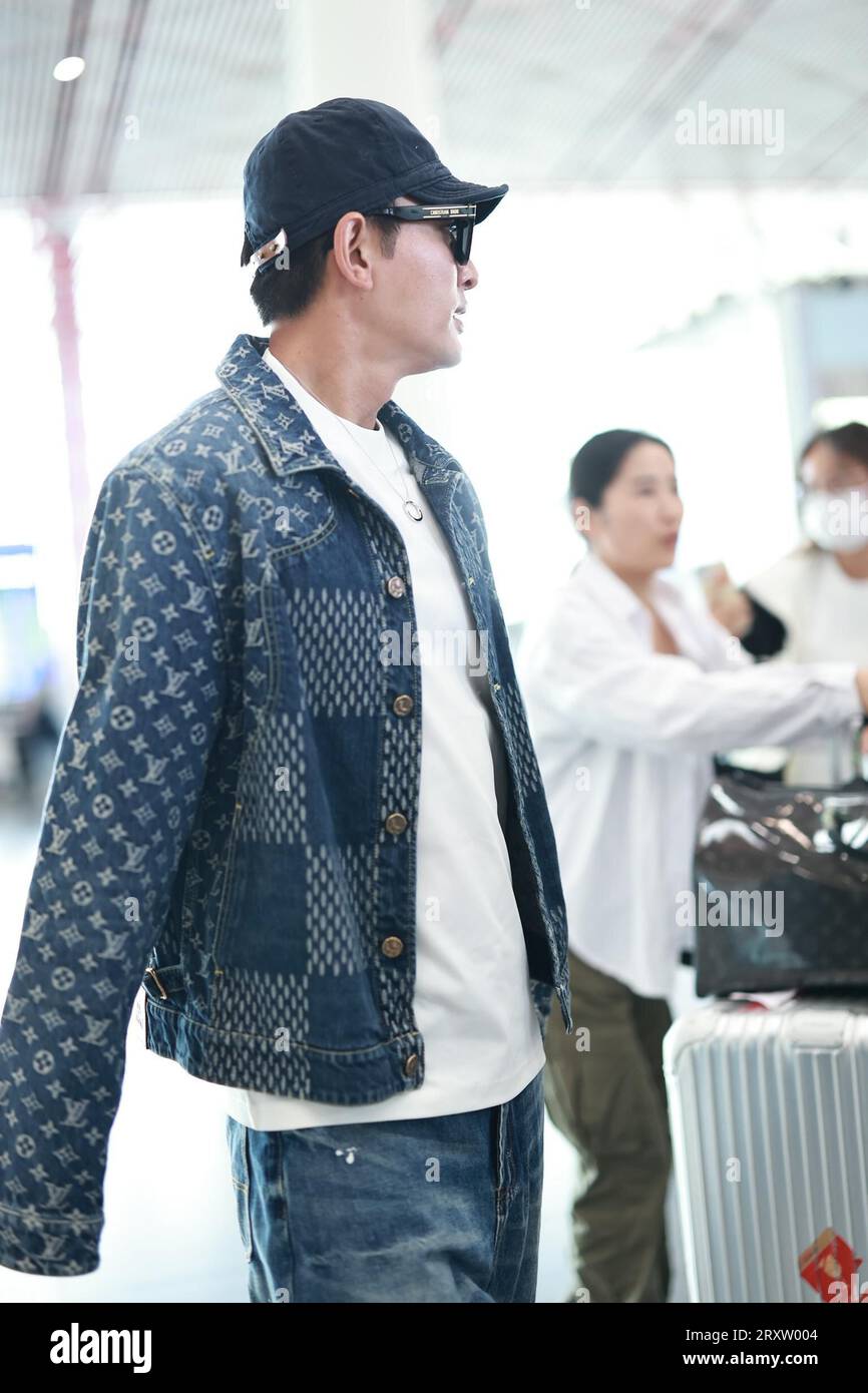 Chinese actor Jia Nailiang appears at the airport in Beijing China 24