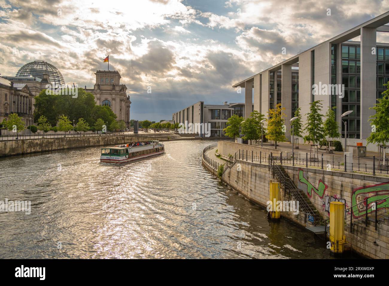 View of sightseeing cruise boat on River Spree and the Reichstag ...