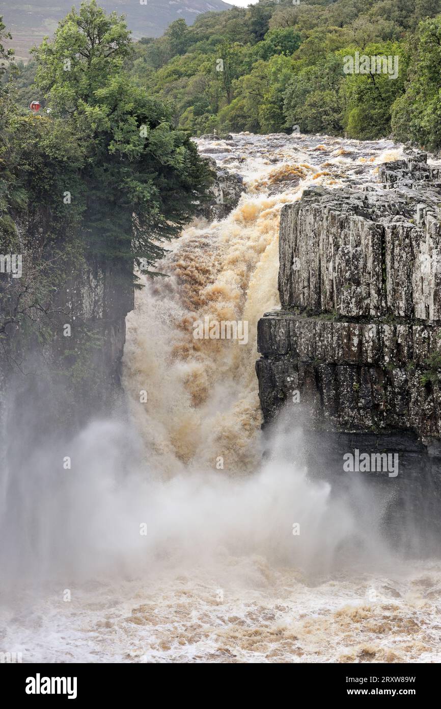 Floodwater thunders over High Force after heavy rain brought by Ex Hurricane Lee hit Northern England, Teesdale, County Durham, UK Stock Photo