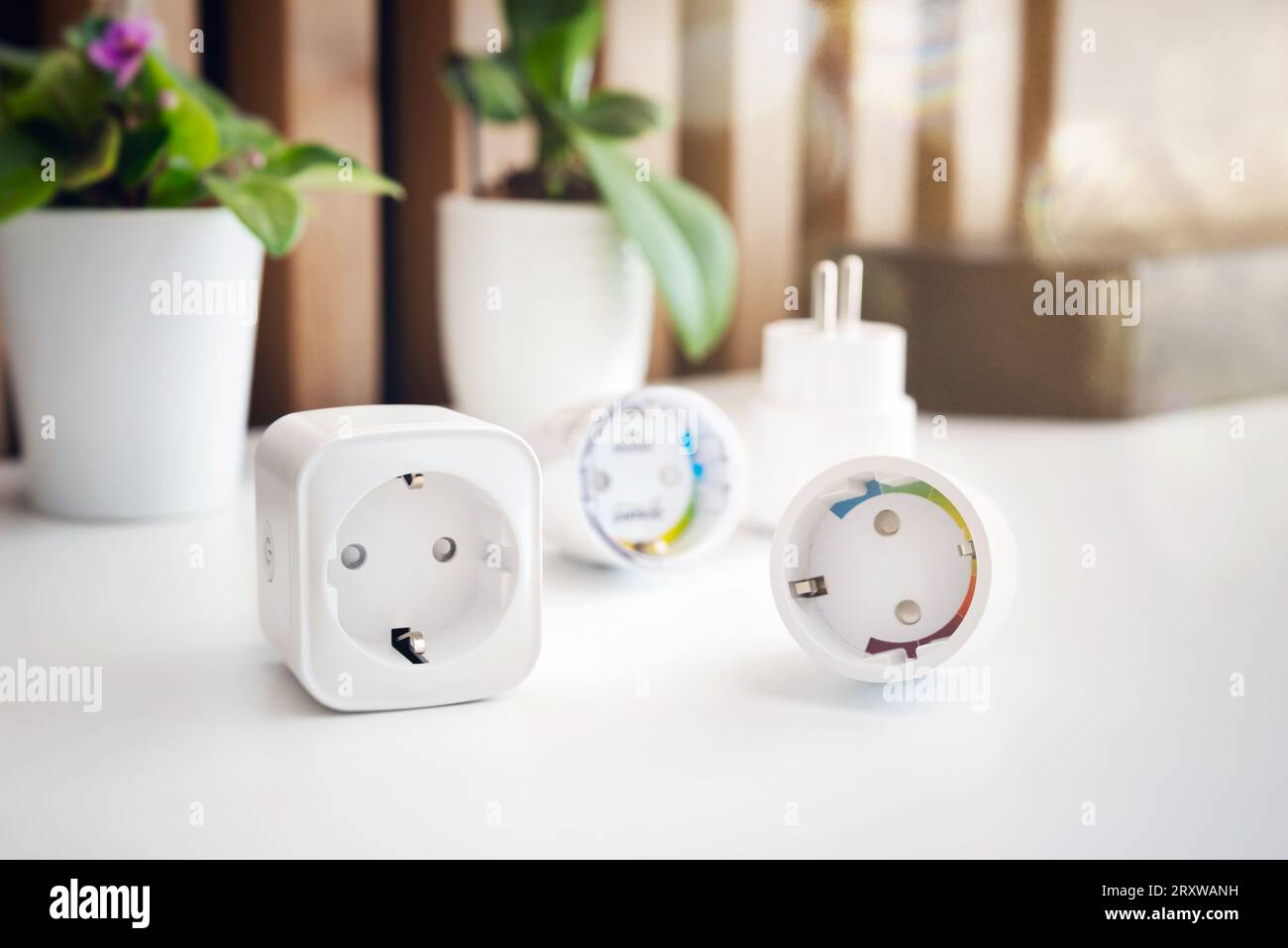 Using Wi-fi smart sockets in a smart home, controlling electricity consumption Stock Photo