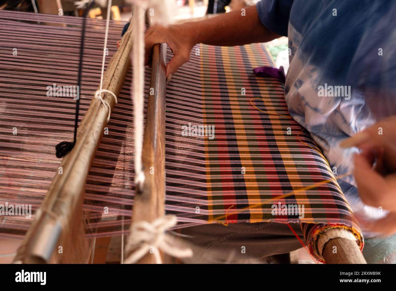 The traditional weaving of handmade cotton on the manual wood loom in ...