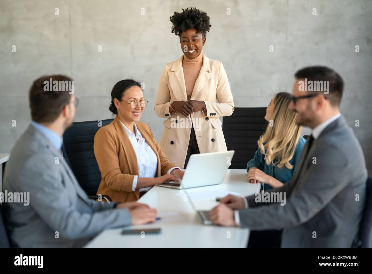 Multicultural professional businesspeople working together on research ...