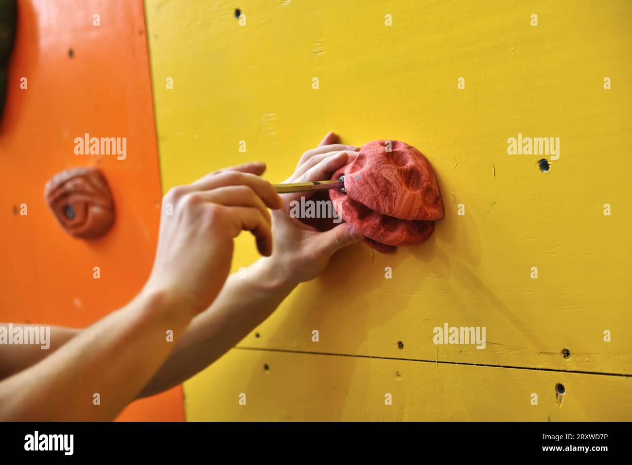 climber will  gathers an artificial wall for rock-climbing Stock Photo