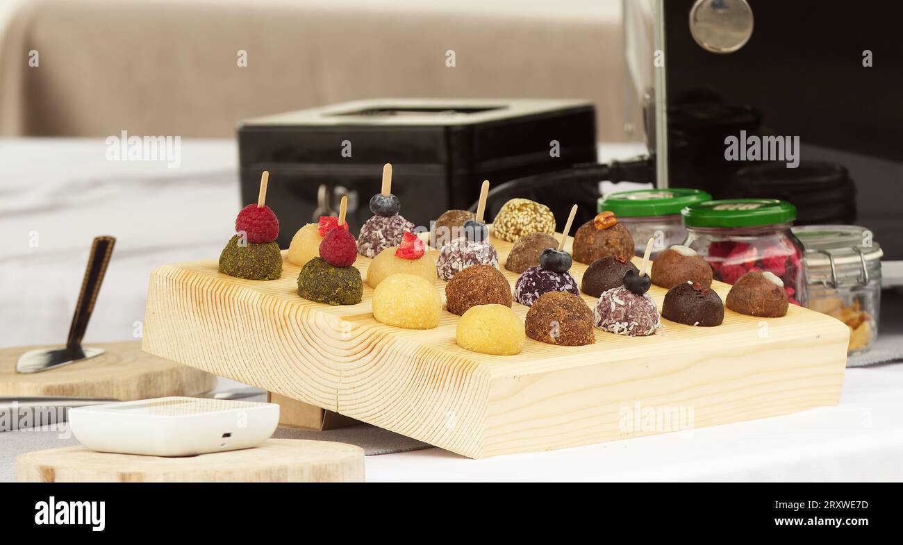 No-bake raw and vegan balls on a confectionery stall for sale at the farmers market Stock Photo