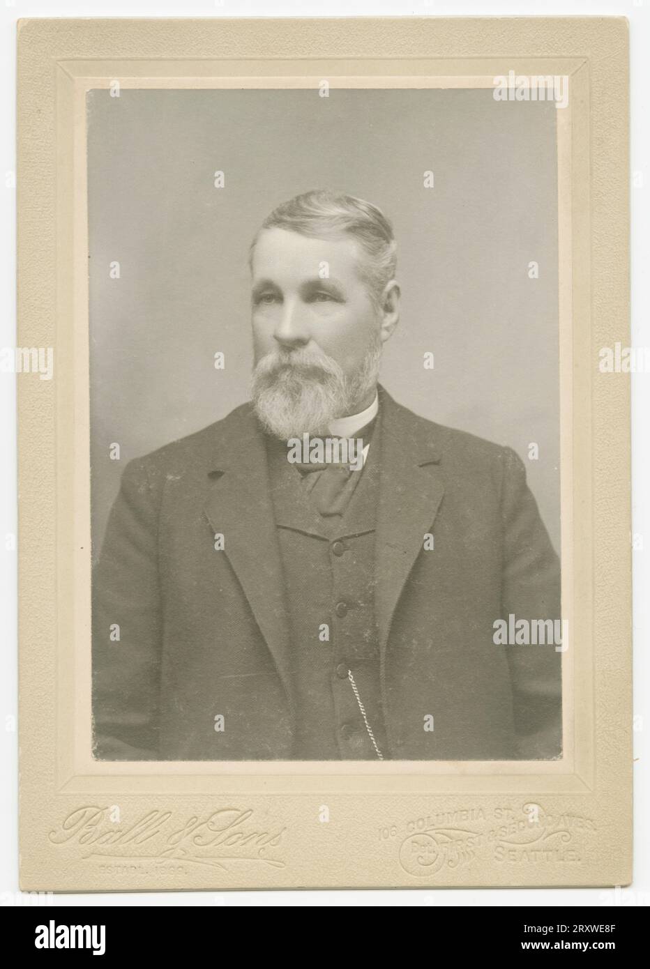 A blackandwhite photograph of a man photographed at the Ball & Sons