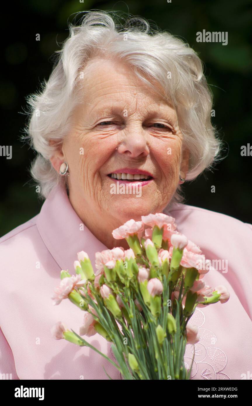 Portrait of a cheerful female senior - John Gollop Stock Photo