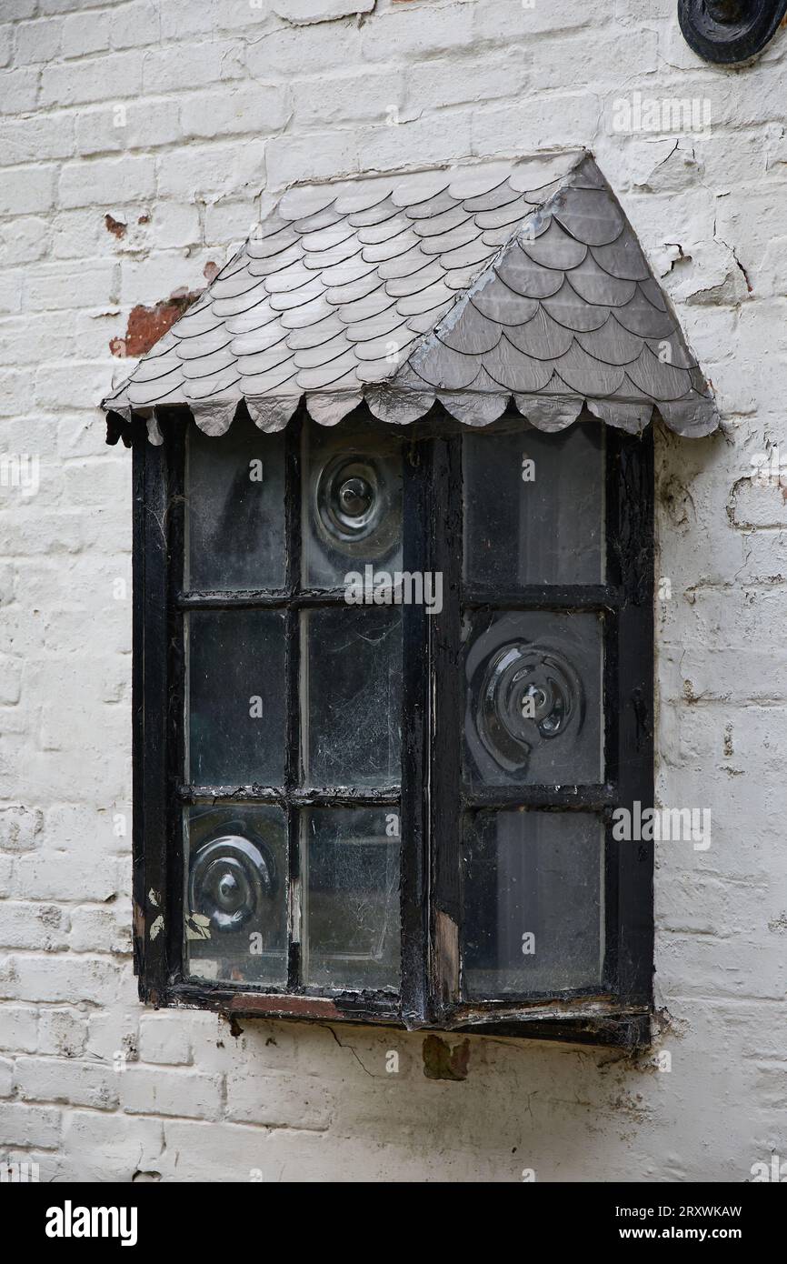 Alford, Lincolnshire, UK,  September 21. View of an old derelict window at Claythorpe Watermill in Alford, Lincolnshire on September 21, 2023 Stock Photo
