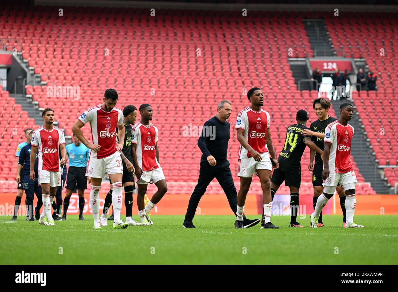 AMSTERDAM - (l-r) Devyne Rensch of Ajax, Josip Sutalo of Ajax, Jorrel Hato of Ajax, Ajax coach Maurice Steijn, Chuba Akpom of Ajax leave the field disappointed after the Dutch premier league match between Ajax Amsterdam and Feyenoord Rotterdam in the Johan Cruijff ArenA on September 27, 2023 in Amsterdam, Netherlands. The match will be played without an audience. The game was finally stopped on Sunday after 55 minutes with Feyenoord taking a 3-0 lead after repeated fireworks on the field. ANP OLAF KRAAK Stock Photo