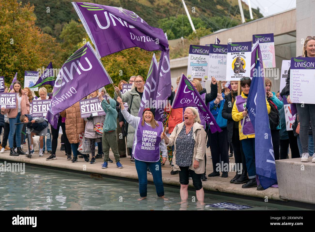 School support staff members of Unison during a rally outside the Scottish parliament in Holyrood, Edinburgh. Essential school staff including cleaners, janitors and support workers have been locked in a pay dispute, with a new offer estimated to cost £580 million. Picture date: Wednesday September 27, 2023. Stock Photo