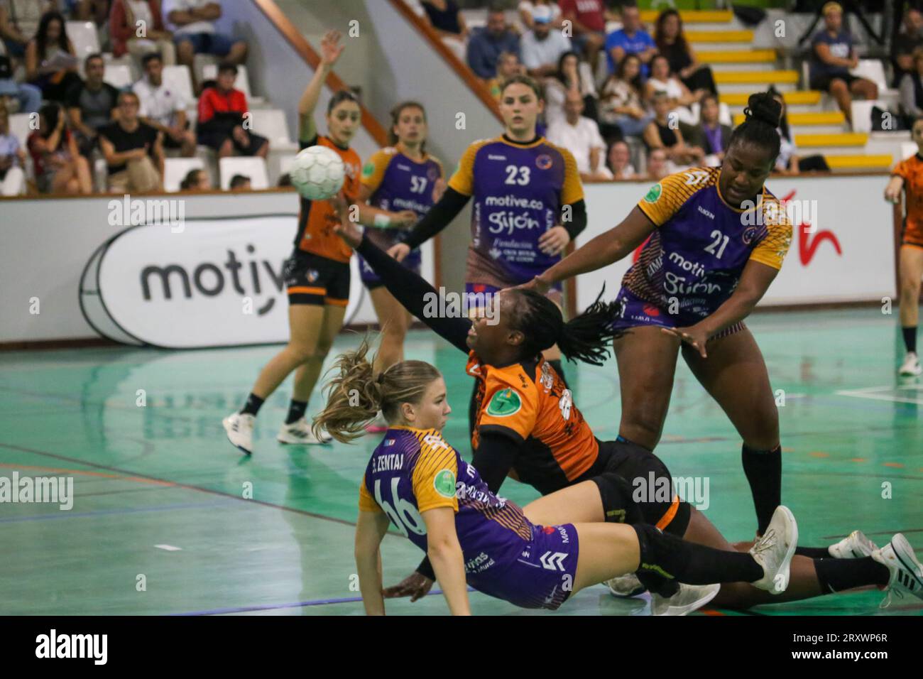 September 26, 2023, Gijon, Asturias, Spain: Gijon, Spain, 26th September, 2023: Super Amara Bera Bera player Lyndie Tchaptchet (20) shoots on goal against the defense of Dorottya Margit Zentai (66, L) and Juceleyde Pereira (21, R) during the 8th Matchday of the Iberdrola Guerreras League 2023-24 between Motive.co Gijon Balonmano La Calzada and Super Amara Bera Bera, on September 26, 2023, at the La Arena Sports Pavilion, in GijÃ³n, Spain. (Credit Image: © Alberto Brevers/Pacific Press via ZUMA Press Wire) EDITORIAL USAGE ONLY! Not for Commercial USAGE! Stock Photo