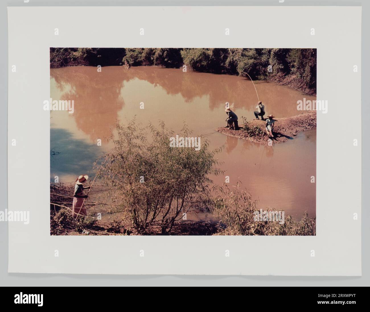 Fishing in creek near cotton plantations outside Belzoni Miss. Delta