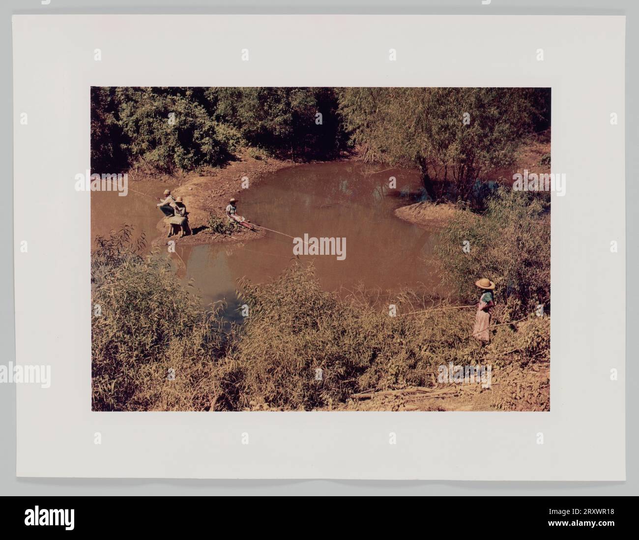 Fishing in creek near cotton plantations outside Belzoni Miss. Delta