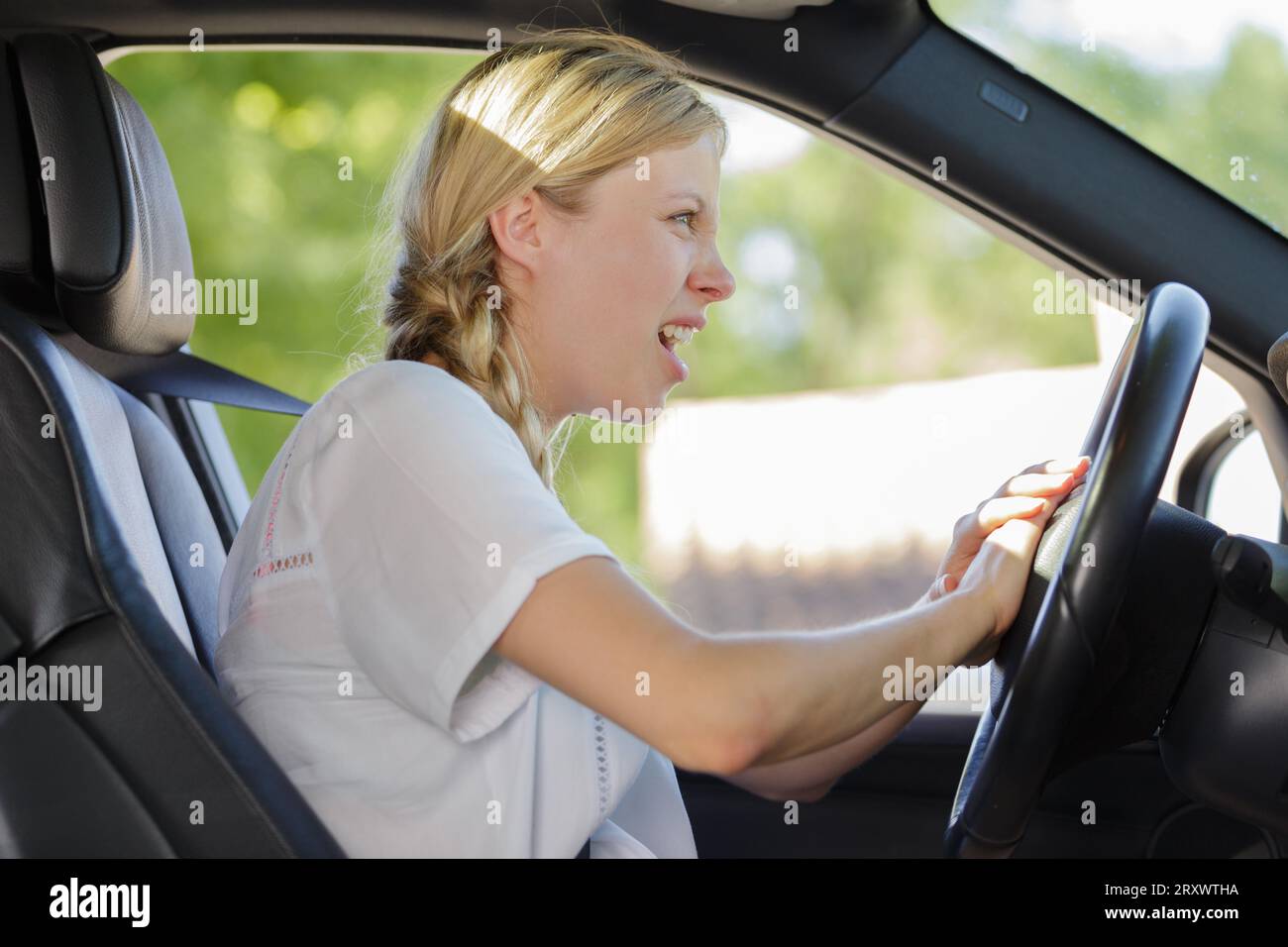 angry woman driving blowing car horn Stock Photo Alamy