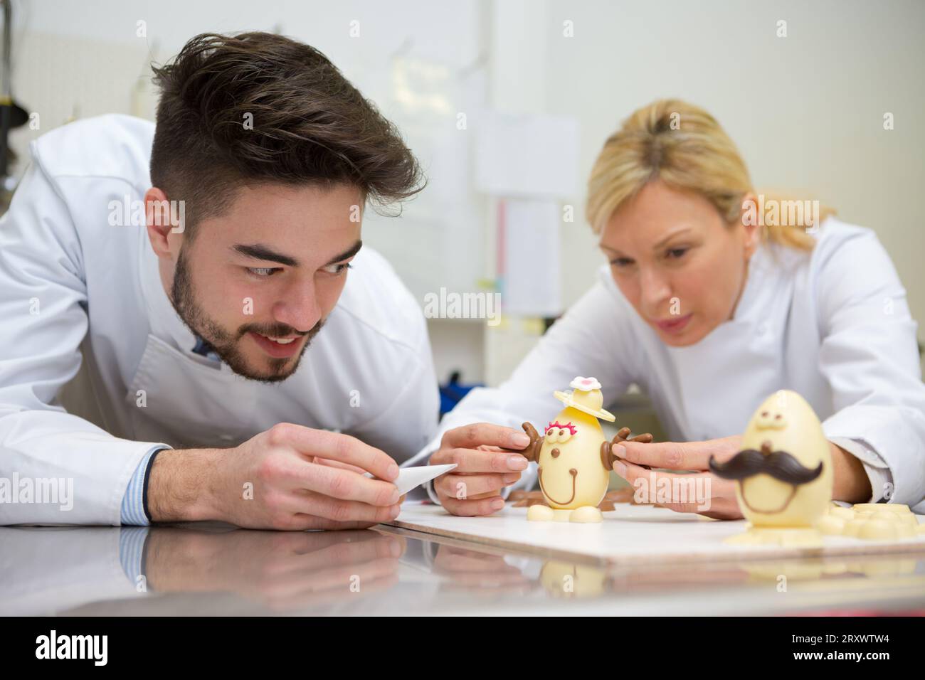 chocolatier artisan decorating easter eggs Stock Photo