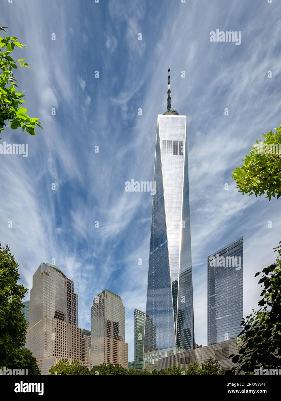 GROUND ZERO, NEW YORK, USA, - SEPTEMBER 16, 2023.  A vertorama landscape of the reflecting pool memorial at Ground Zero and The One World Trade centre Stock Photo