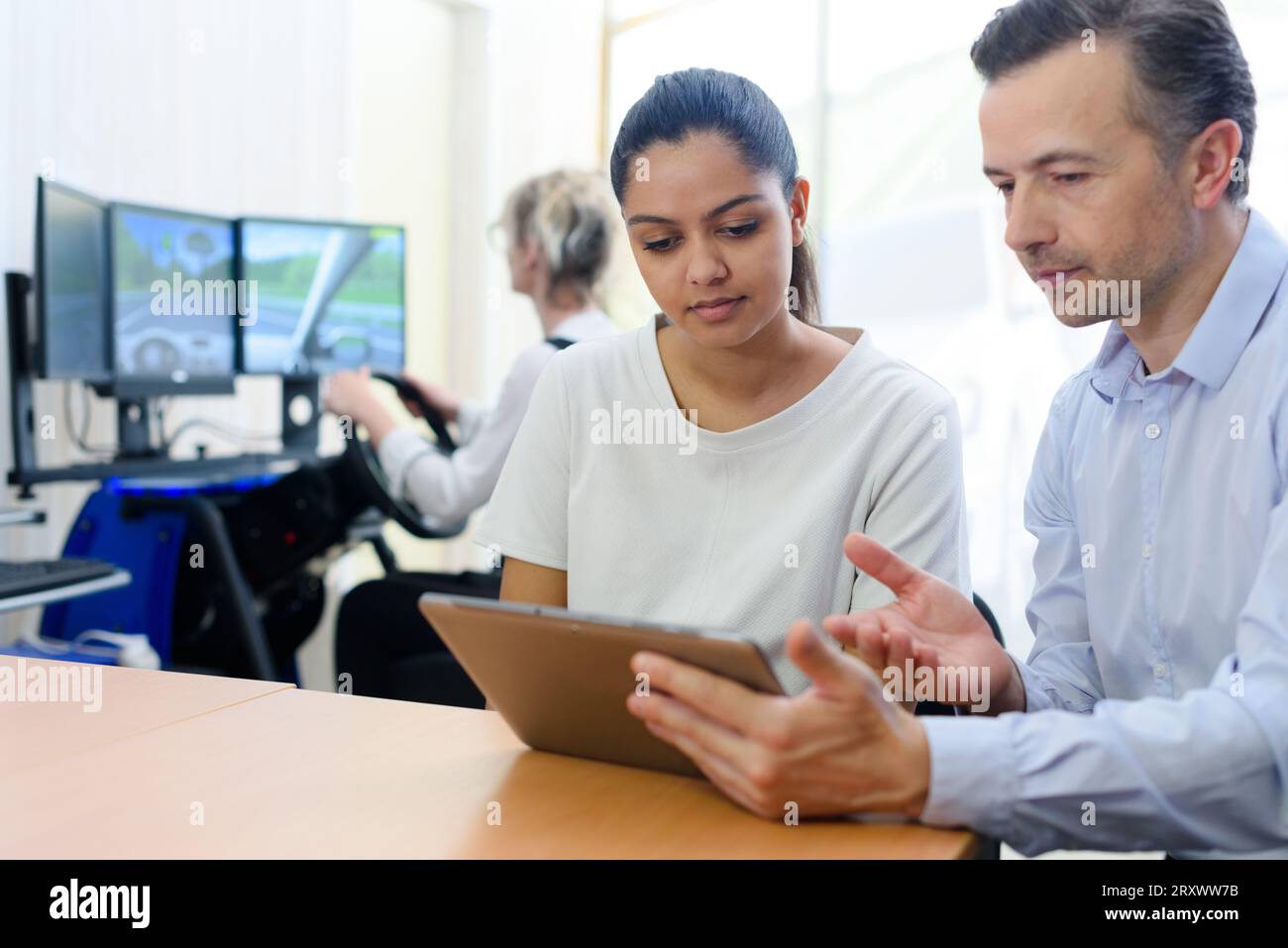 woman learning to drive with a tablet Stock Photo