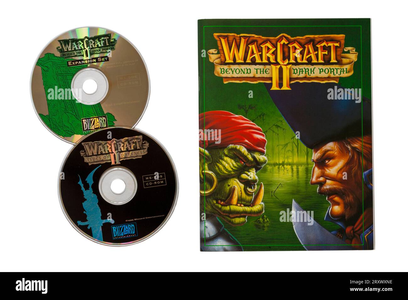 Warcraft II Tides of Darkness deluxe-edition computer game, Warcraft II beyond the dark portal book and discs isolated on white background Stock Photo