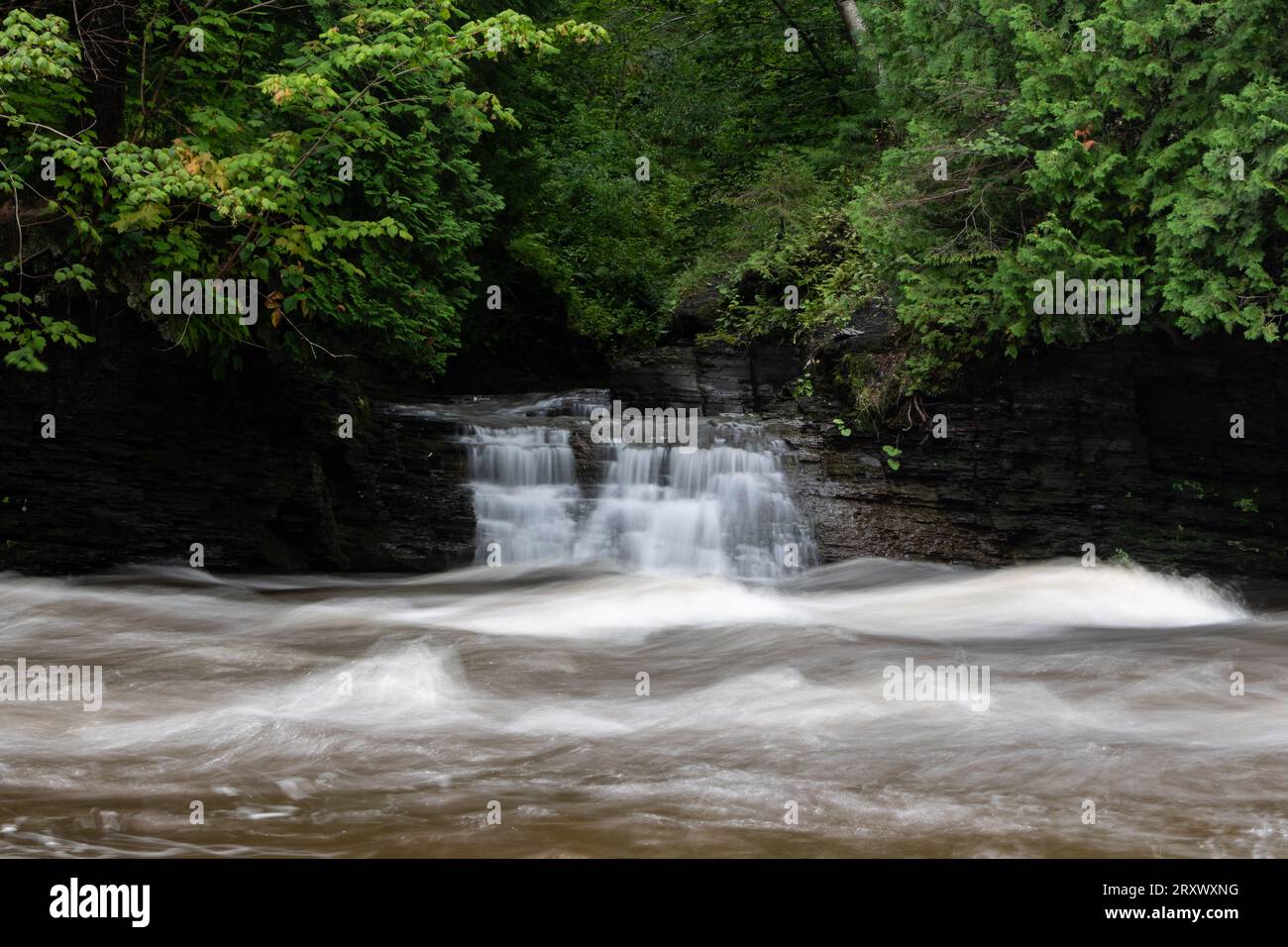 Small waterfall and St. Charles creek in Parc Chauveau using long exposure Stock Photo