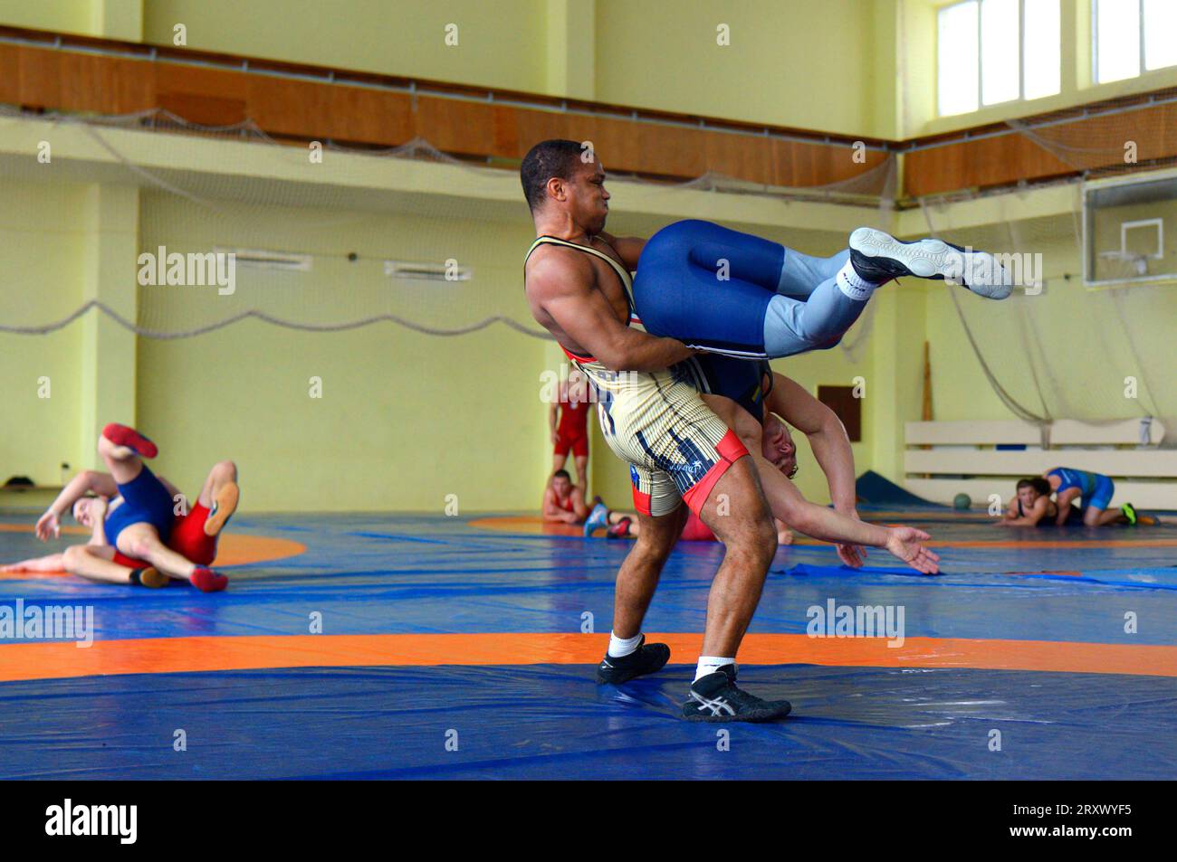 Man wrestler throwing the opponent on a wrestling mat, training. National Greco-Roman wrestling team demonstration training for mass media. Kyiv Stock Photo