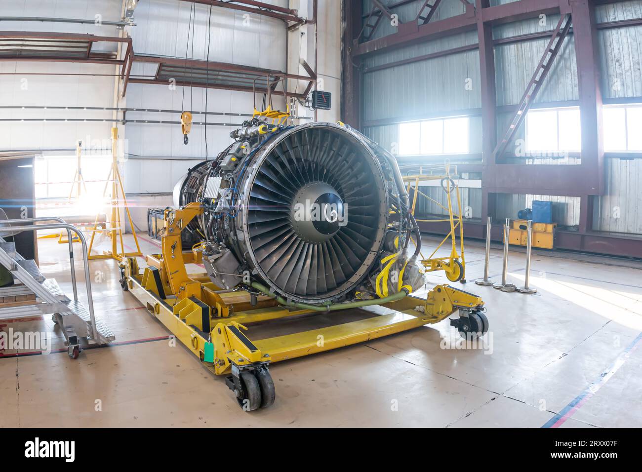 High-bypass turbofan airplane engine in aviation hangar Stock Photo