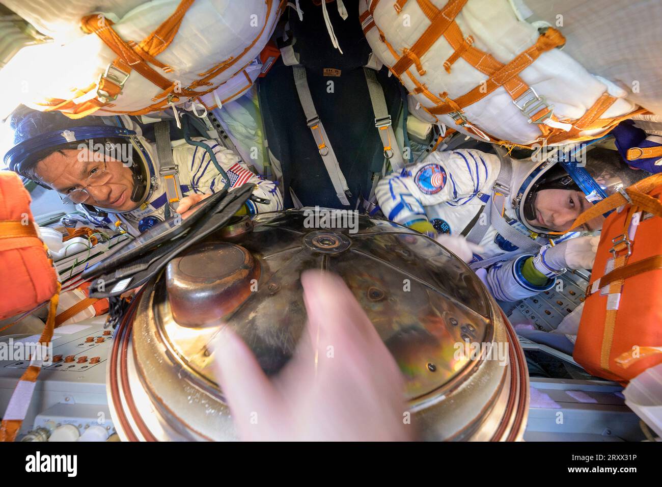 Zhezkazgan, Kazakhstan. 27 September, 2023. Expedition 69 NASA astronaut Frank Rubio, left, and Roscosmos cosmonaut Dmitri Petelin, right, inside the Russian Soyuz MS-23 spacecraft after the hatch is opened on landing, September 27, 2023 in Zhezkazgan, Kazakhstan. Roscosmos cosmonauts Sergey Prokopyev, Dmitri Petelin and NASA astronaut Frank Rubio returned after 371 days aboard the International Space Station.  Credit: Bill Ingalls/NASA/Alamy Live News Stock Photo