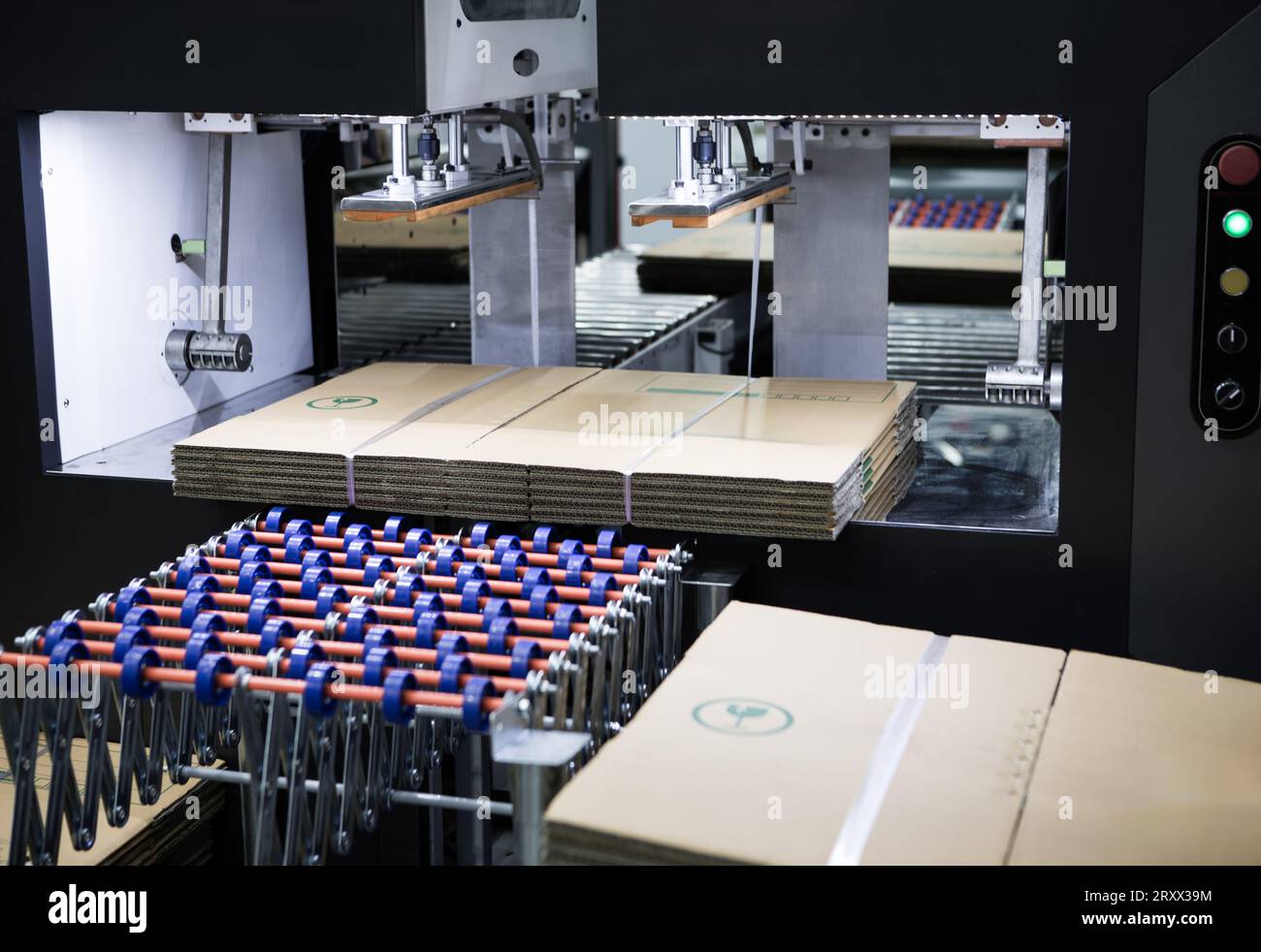 Automatic baler machine. Horizontal balers packing materials. Stock Photo