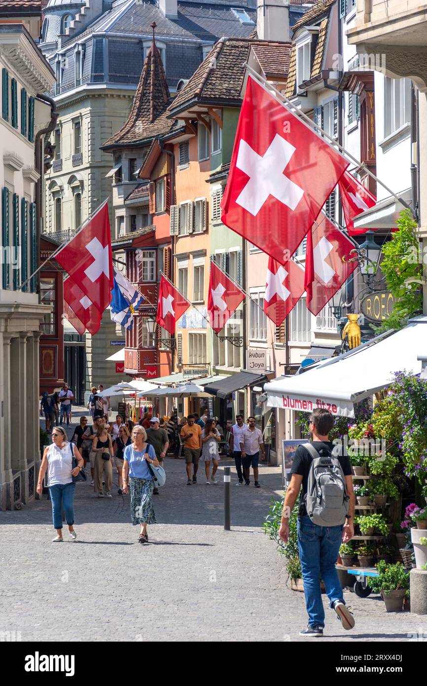 Pedestrianised street with Swiss flags, Augustinergasse, City of Zürich, Zürich, Switzerland Stock Photo