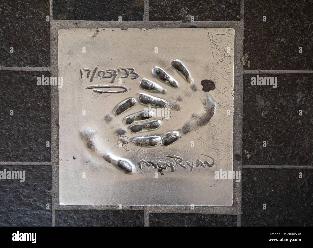 The handprint from famous American actress and film producer Meg Ryan set into the pavement of The Allée des Étoiles (Avenue of the Stars) in Cannes, Stock Photo