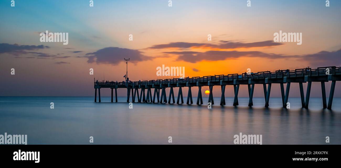 Sunset over the Gulf of Mexico at the Venice Fishing Pier in Venice Florida USA Stock Photo