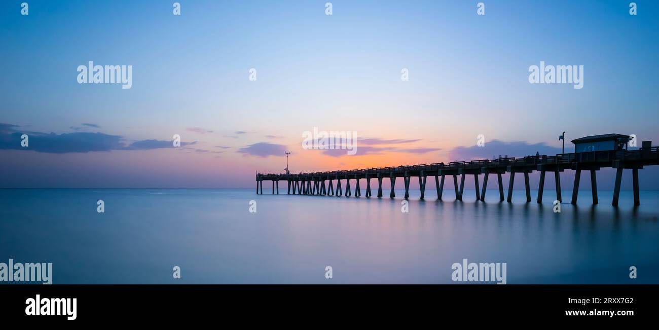 Sunset over the Gulf of Mexico at the Venice Fishing Pier in Venice Florida USA Stock Photo