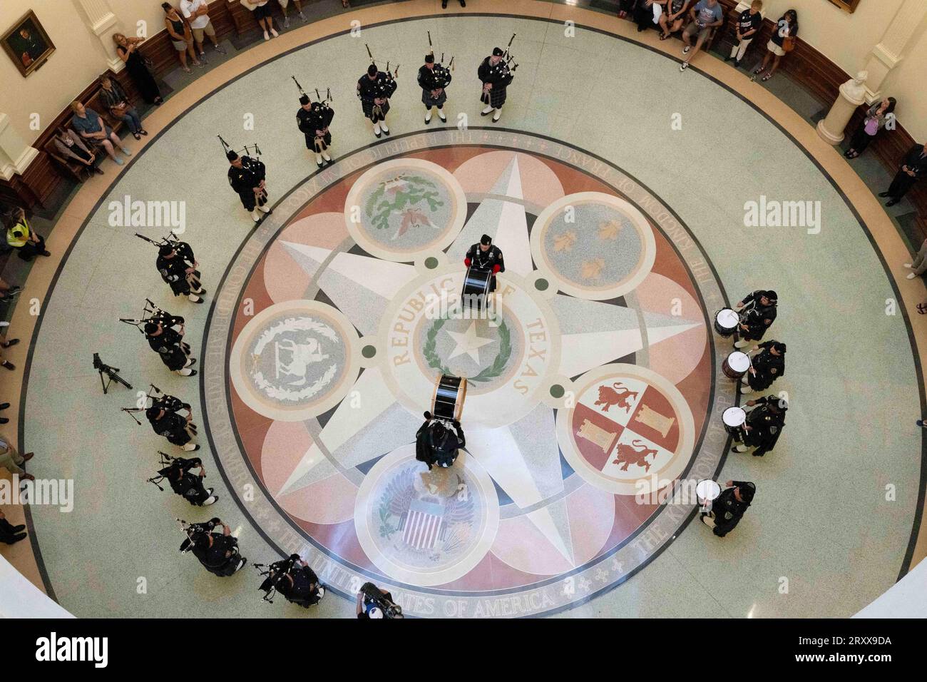 Austin Texas USA, September 11 2023: A Texas-based drum and bagpiper corps performs in the Texas Capitol rotunda on the 22nd anniversary of the September 11th attacks with a somber remembrance ceremony. Tourists watched from the 2nd and 3rd balconies during the memorial service. ©Bob Daemmrich Stock Photo