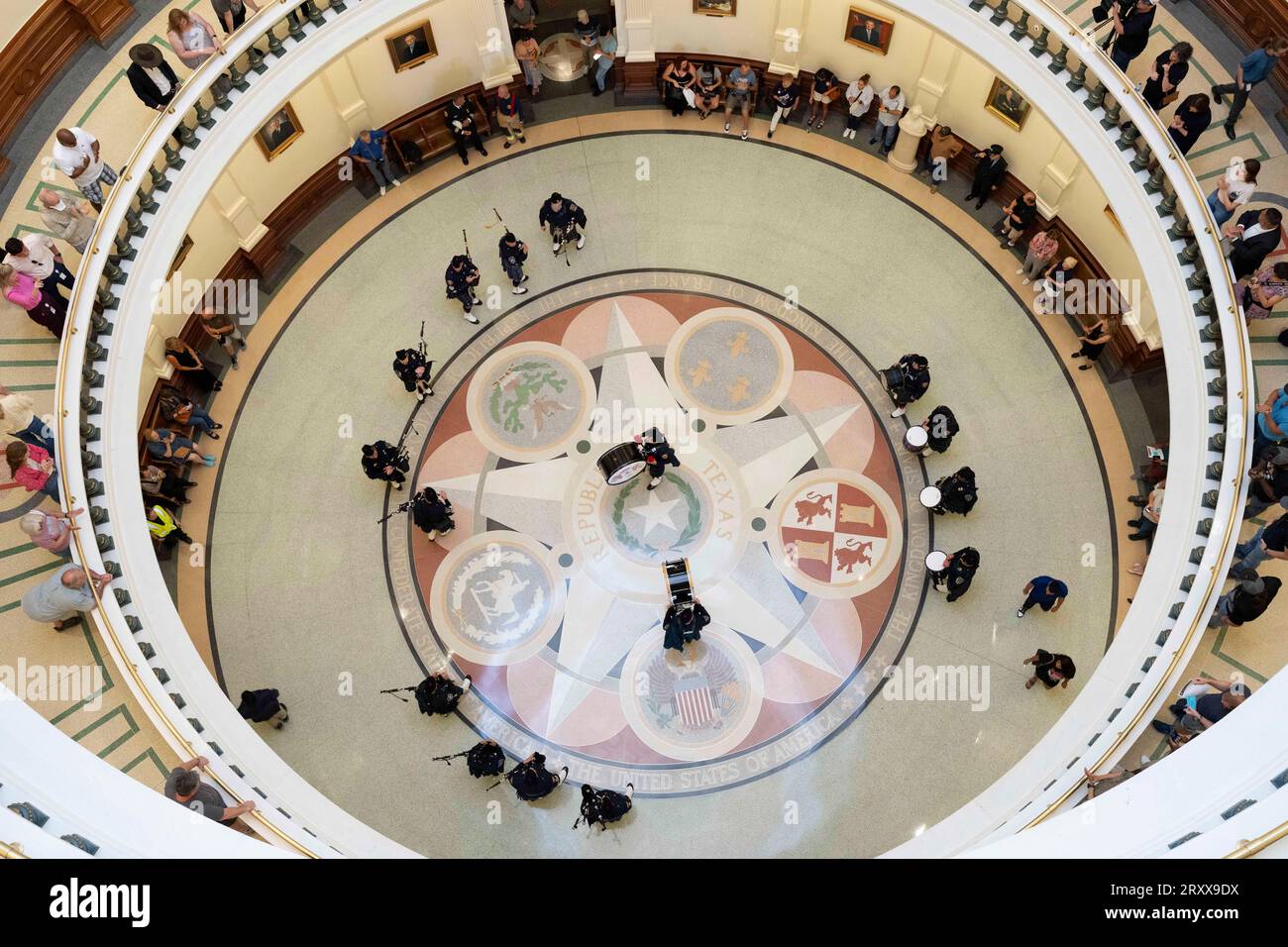Austin Texas USA, September 11 2023: A Texas-based drum and bagpiper corps performs in the Texas Capitol rotunda on the 22nd anniversary of the September 11th attacks with a somber remembrance ceremony. Tourists watched from the 2nd and 3rd balconies during the memorial service. ©Bob Daemmrich Stock Photo