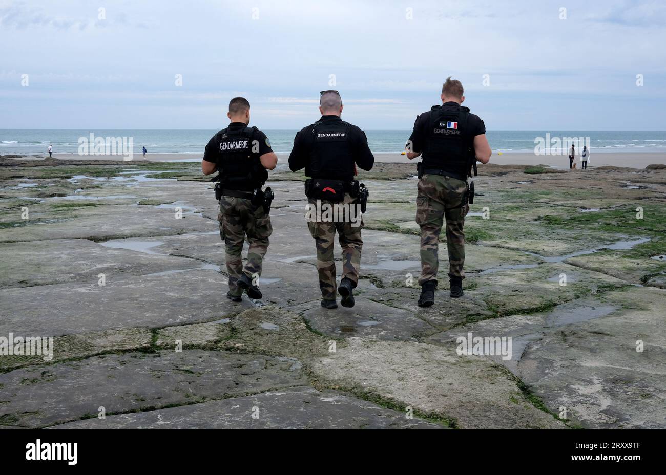 Ambleteuse, Northern France. September 27th 2023. French Gendarmes on beach patrol. Armed French police officers patroling the beach at Ambleteuse, one of the main channel crossing departure beaches used by migrants in dinghies trying to reach the UK. Credit: Dave Bagnall Stock Photo