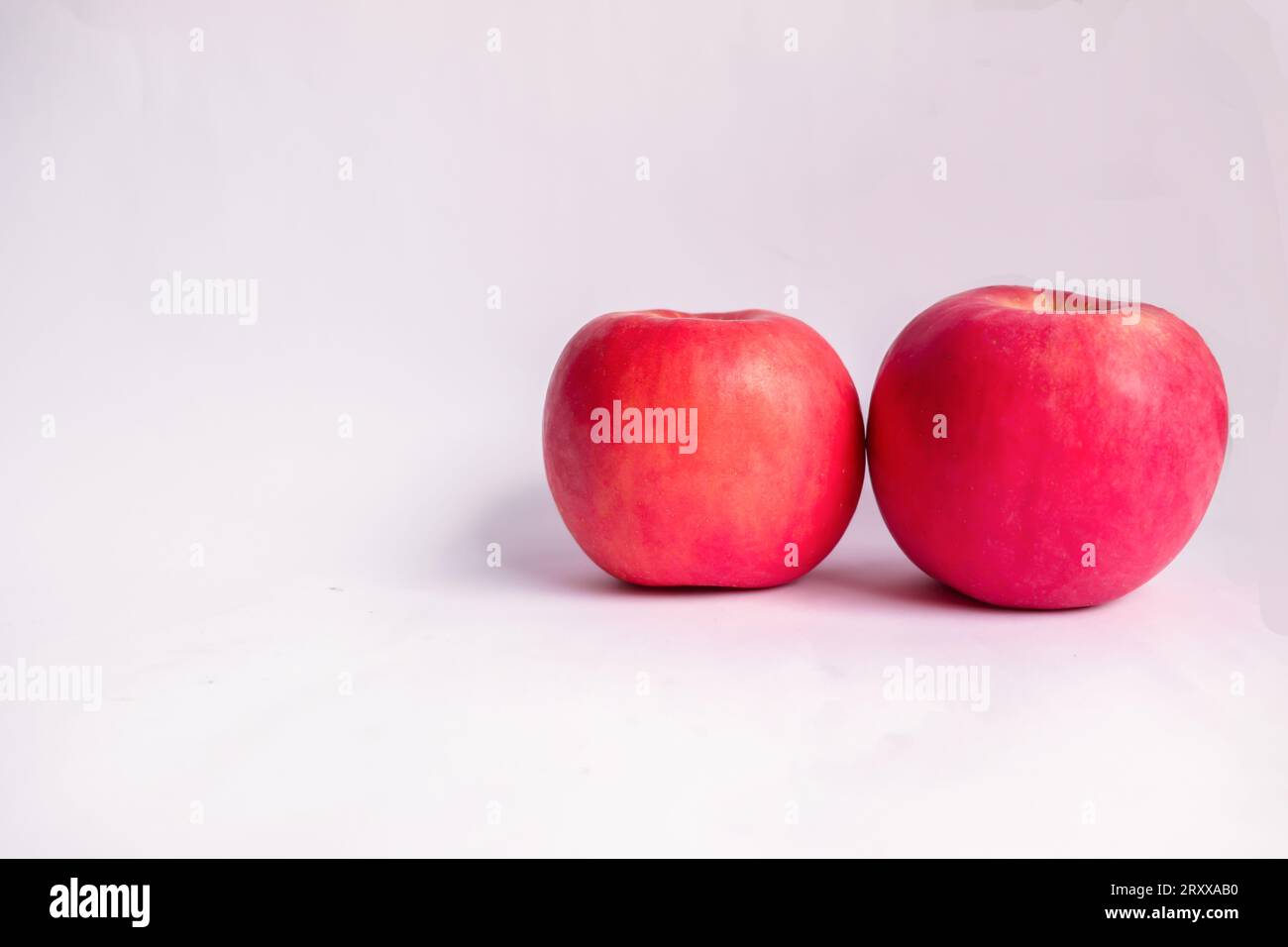 Two Red Fuji Apples in White Isolated Background Stock Photo