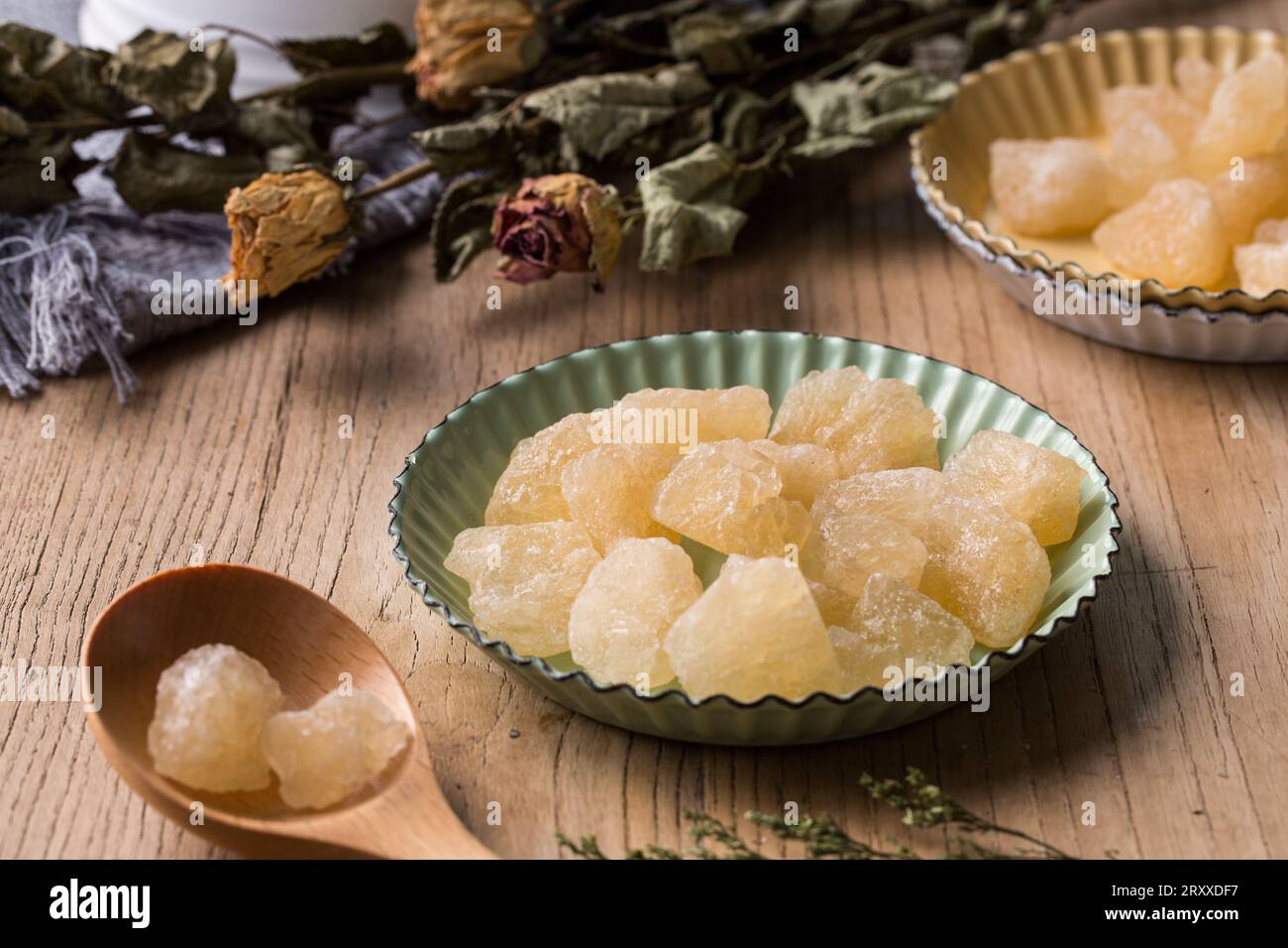 Old Rock sugar in a bowl on white background. Stock Photo