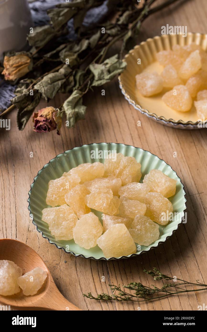 Old Rock sugar in a bowl on white background. Stock Photo