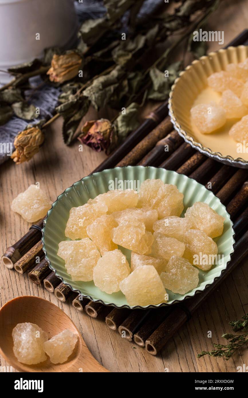 Old Rock sugar in a bowl on white background. Stock Photo
