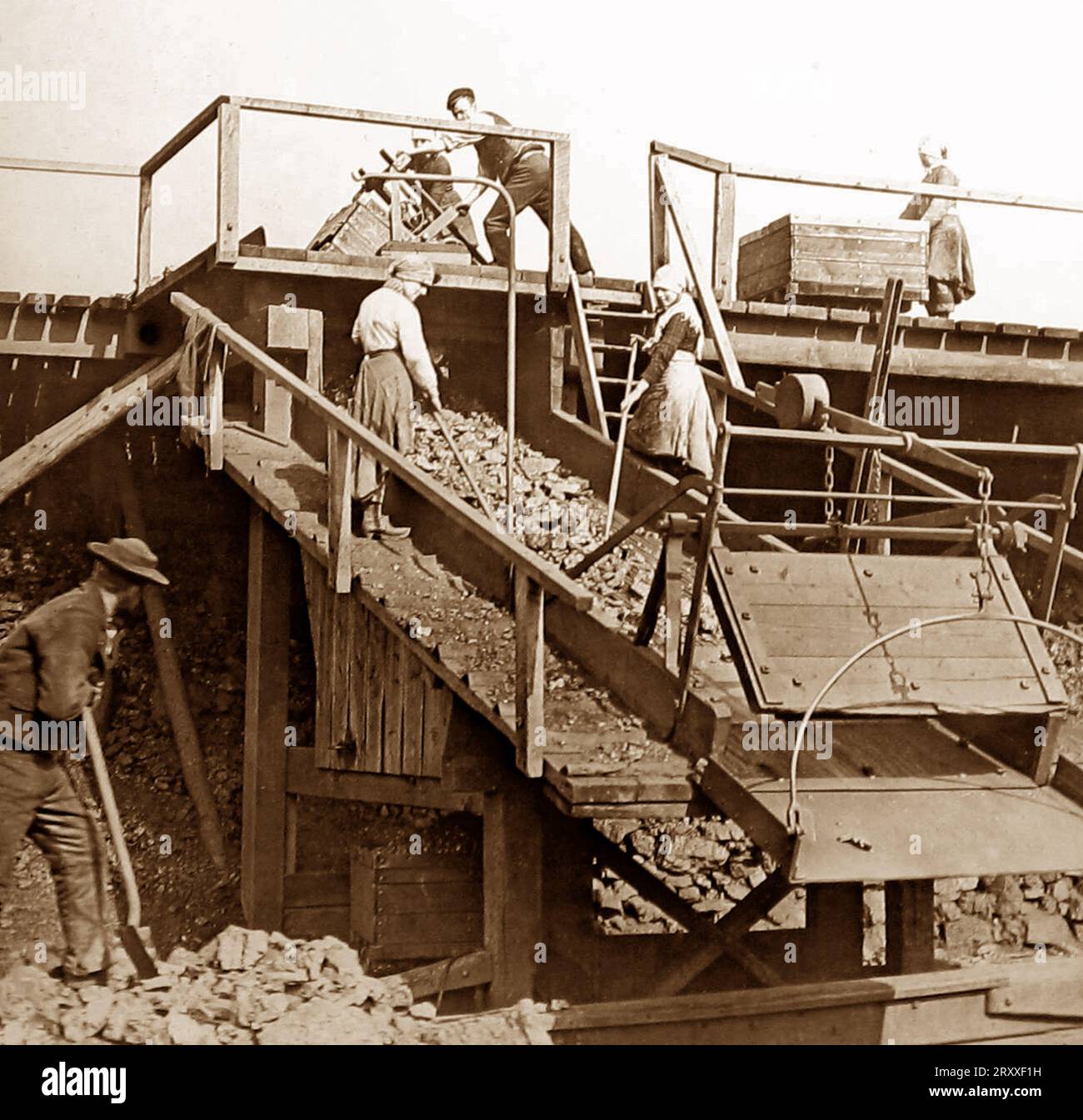 Pit lasses working on a scree at an English coal mine, Victorian period Stock Photo