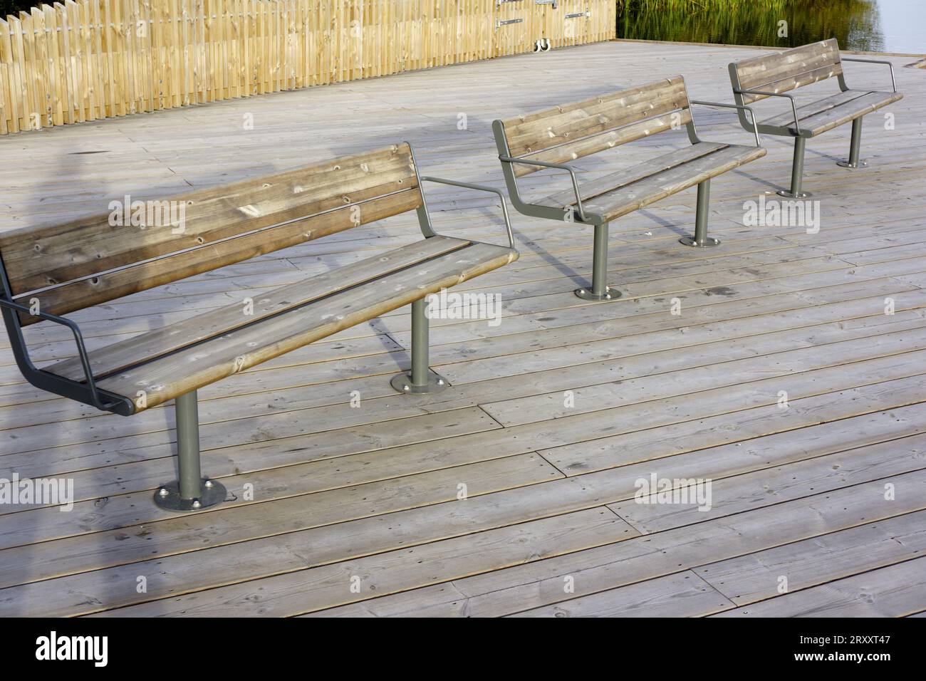 Empty benches in a row Stock Photo - Alamy