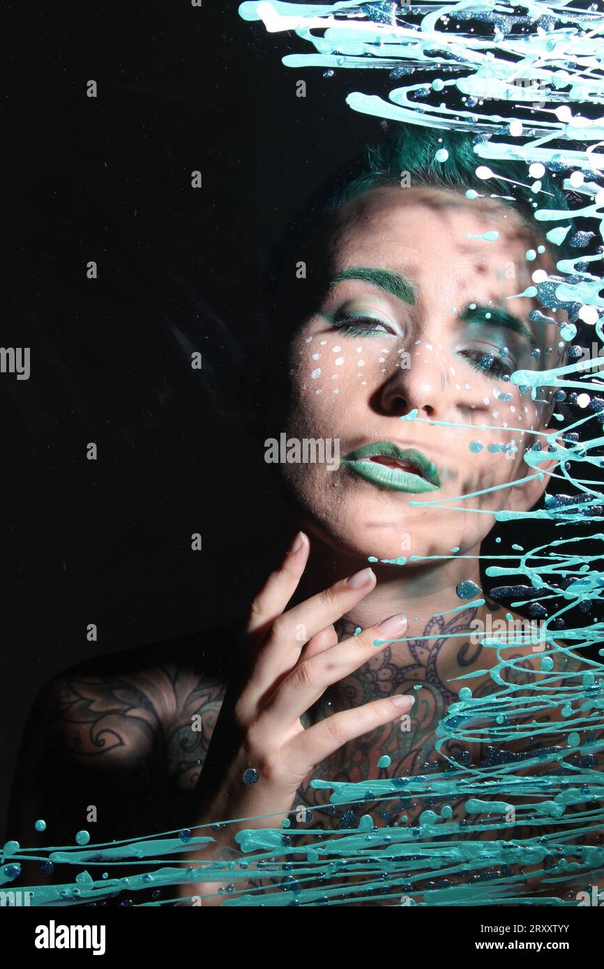 Photoshoot of a model behind glass Stock Photo Alamy