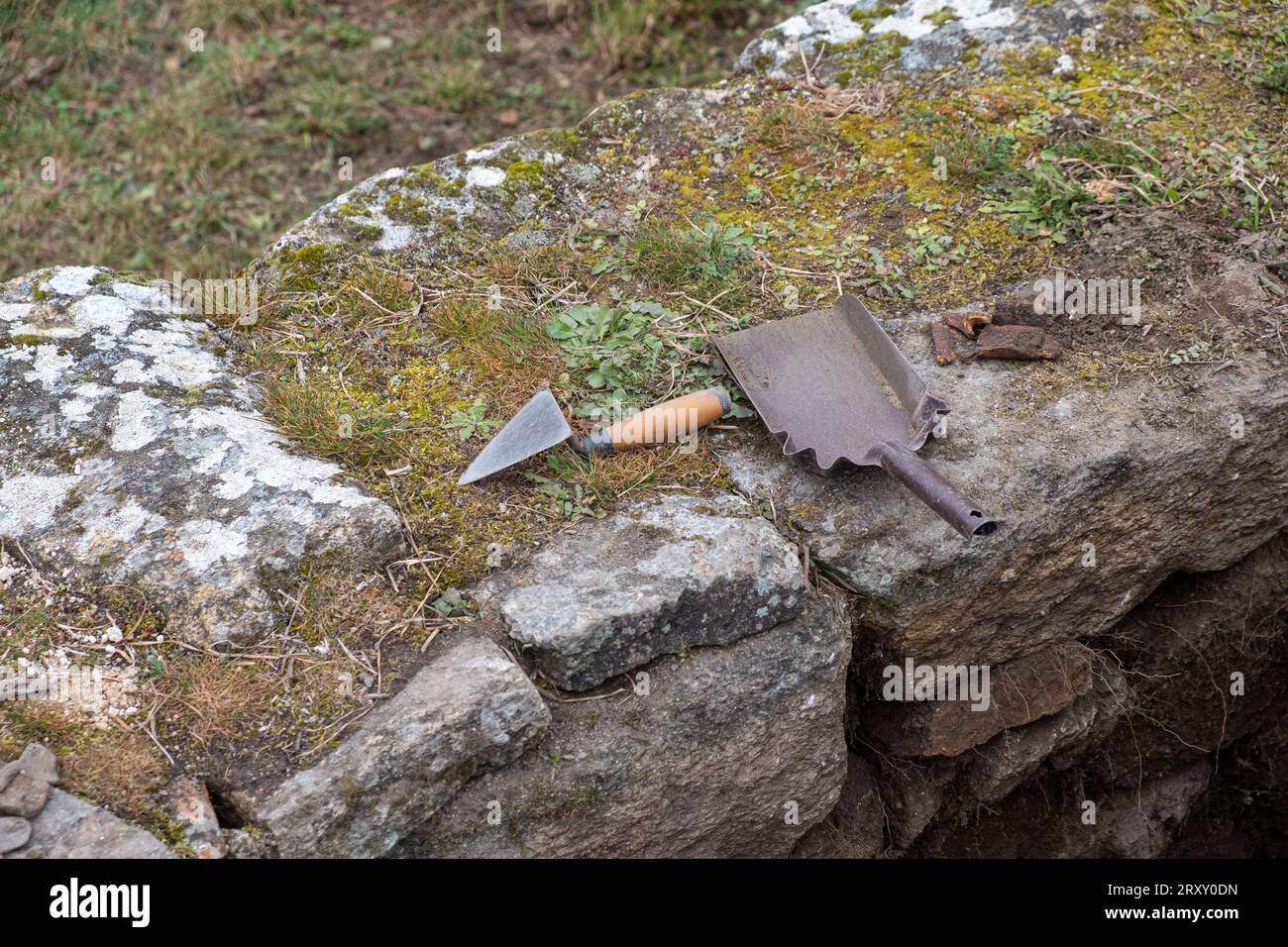 Tools of an archaeologist on a wall in an archaeological excavation