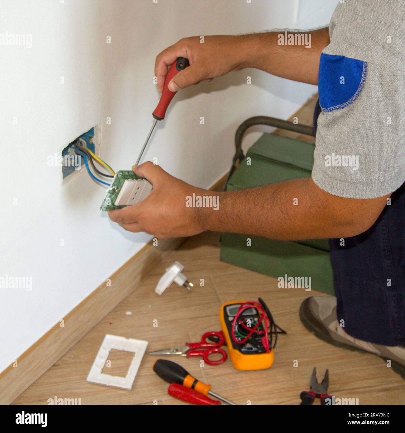 Image of a handyman electrician repairing and installing a home ...