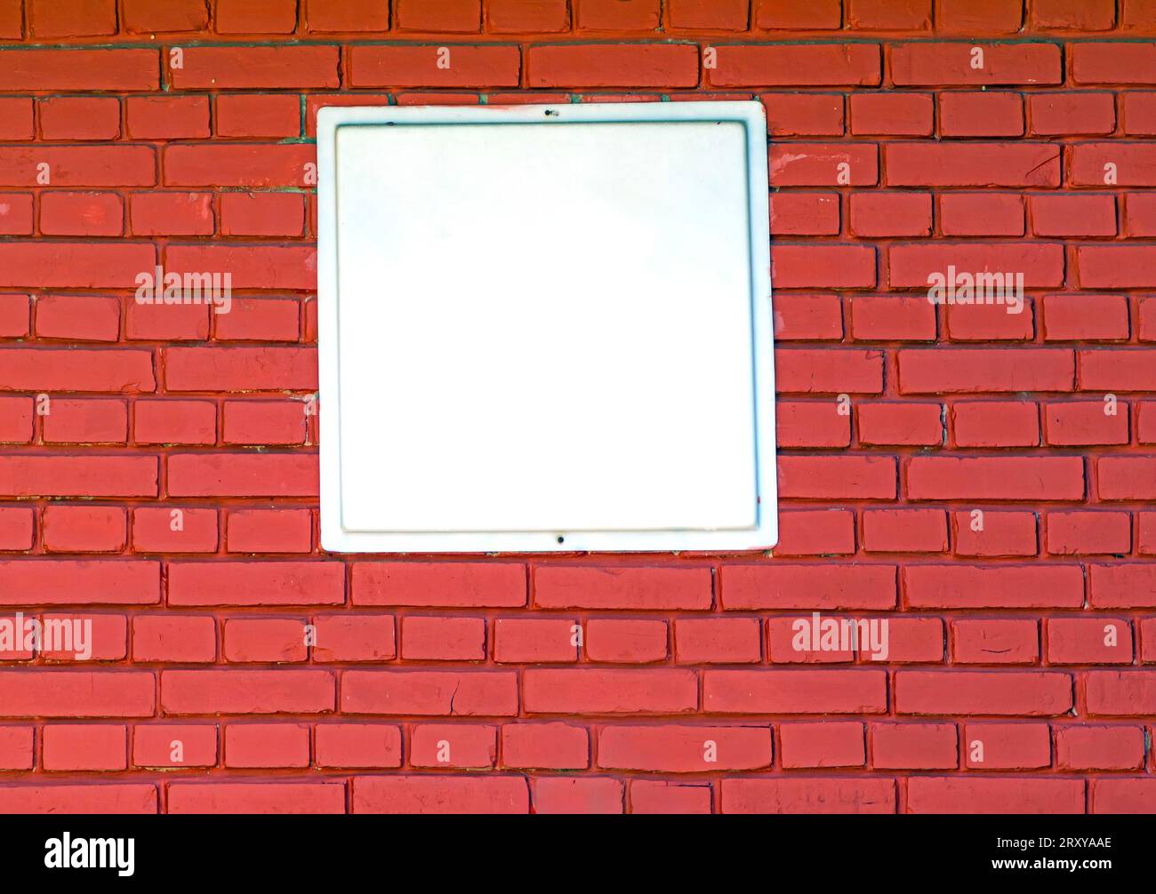 Dark red brick wall texture pattern with empty white background in the middle Stock Photo