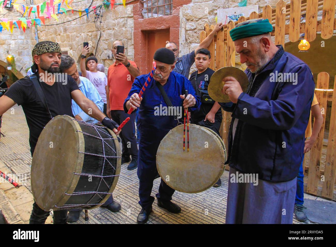 Palestinians beat drums, during the celebration of the birth of the Prophet Muhammad, in the Old