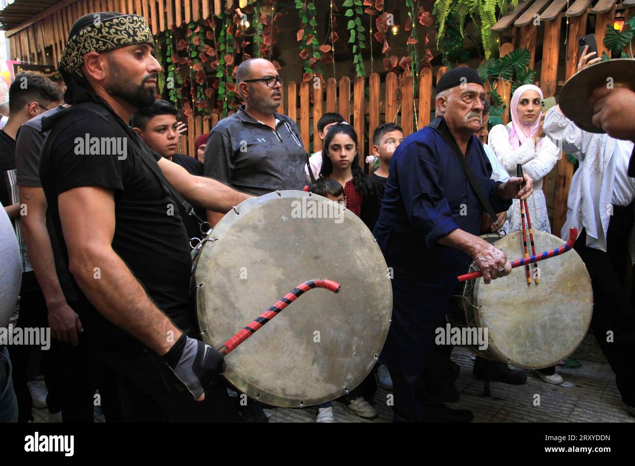 Palestinians beat drums, during the celebration of the birth of the Prophet Muhammad, in the Old
