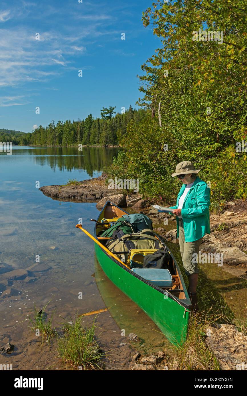 Map of boundary waters canoe area - Checking The Route On A Beautiful Wilderness Lake On The Kekekabic Ponds In The Boundary Waters Canoe Area In Minnesota 2RXYG7N 