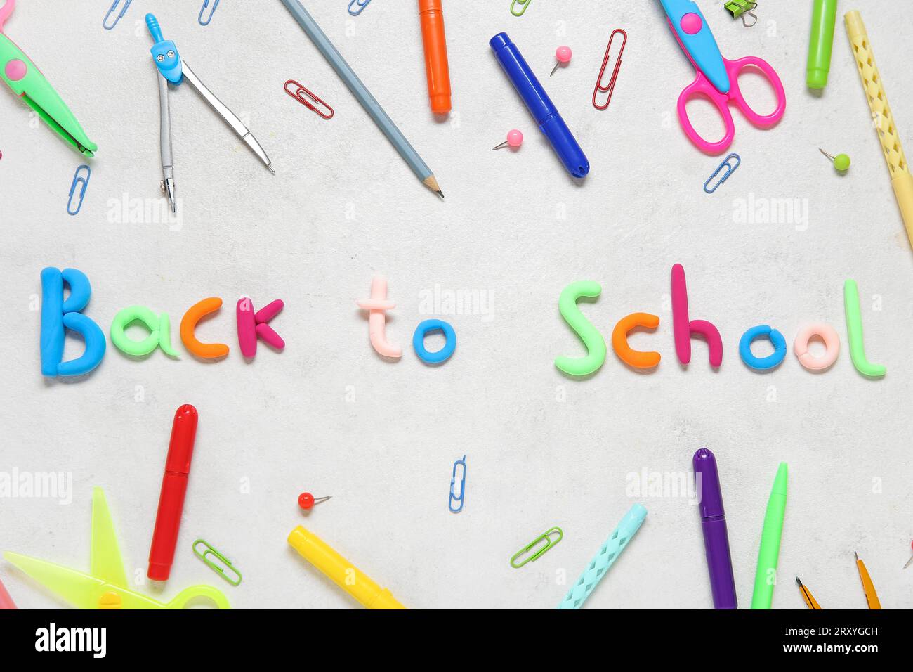 Text BACK TO SCHOOL and stationery on light background Stock Photo - Alamy
